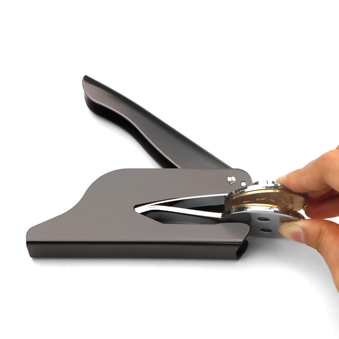 Remove the clip plate from the end of the embosser press.